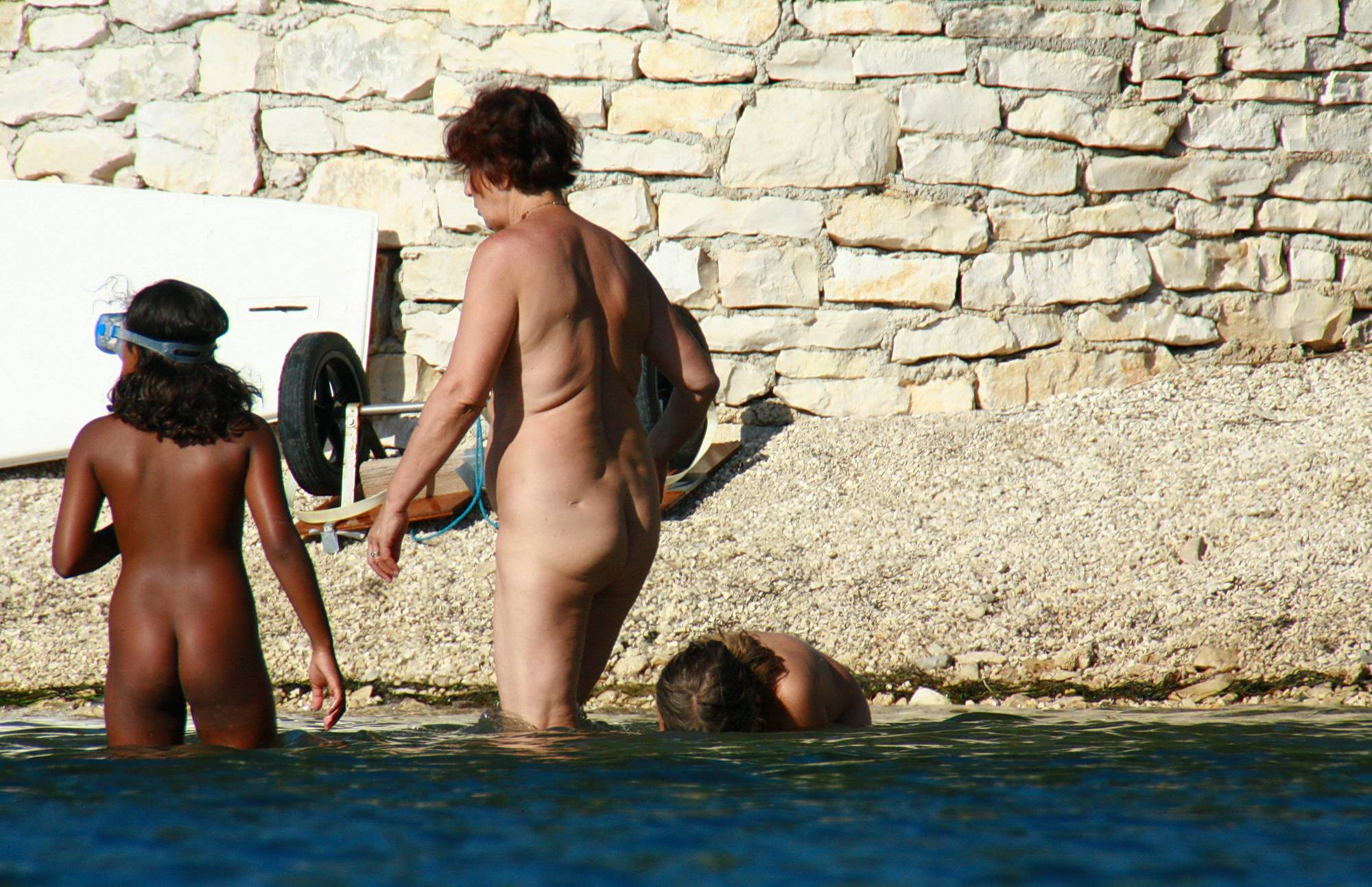 Pure Nudism Dipping Into The Lake - 1