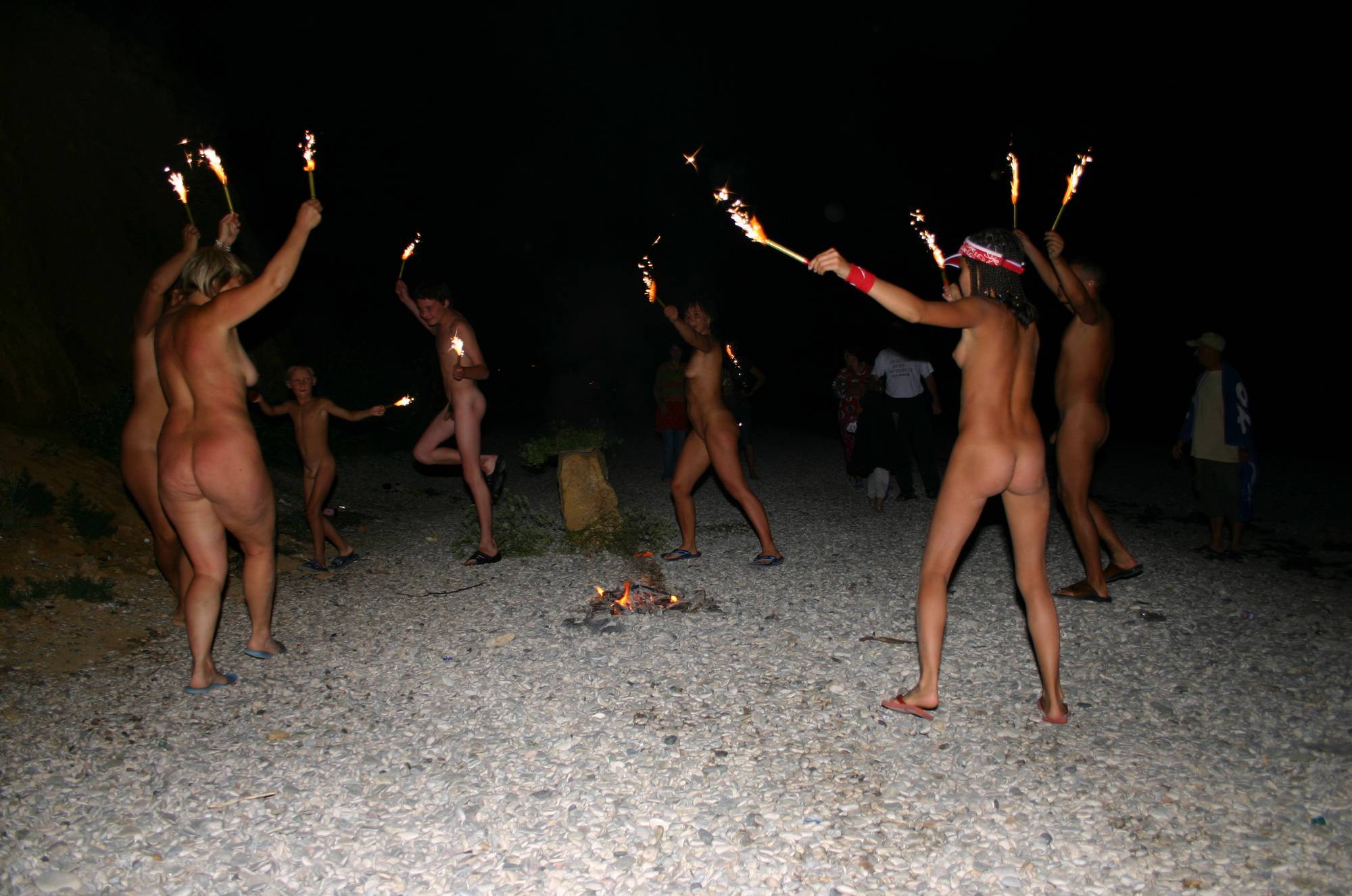 Family Nudism Pics - Fire and Bow Night Dancing - 1